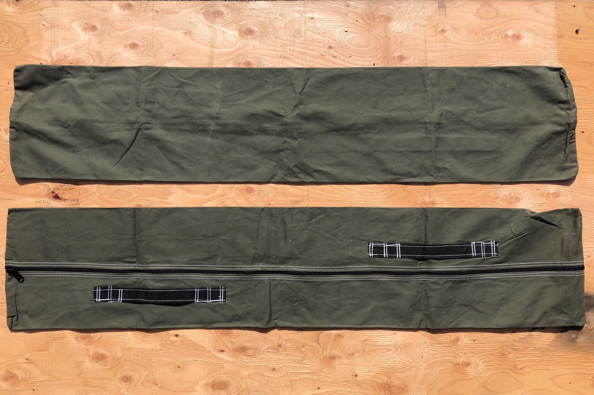 Green frame bag with two handles.