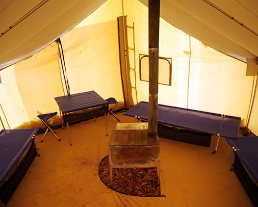 Inside of Montana Lodge Tent showing stove placement