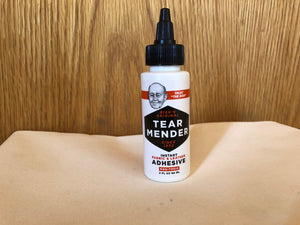 Bottle of Tear Mender and Canvas