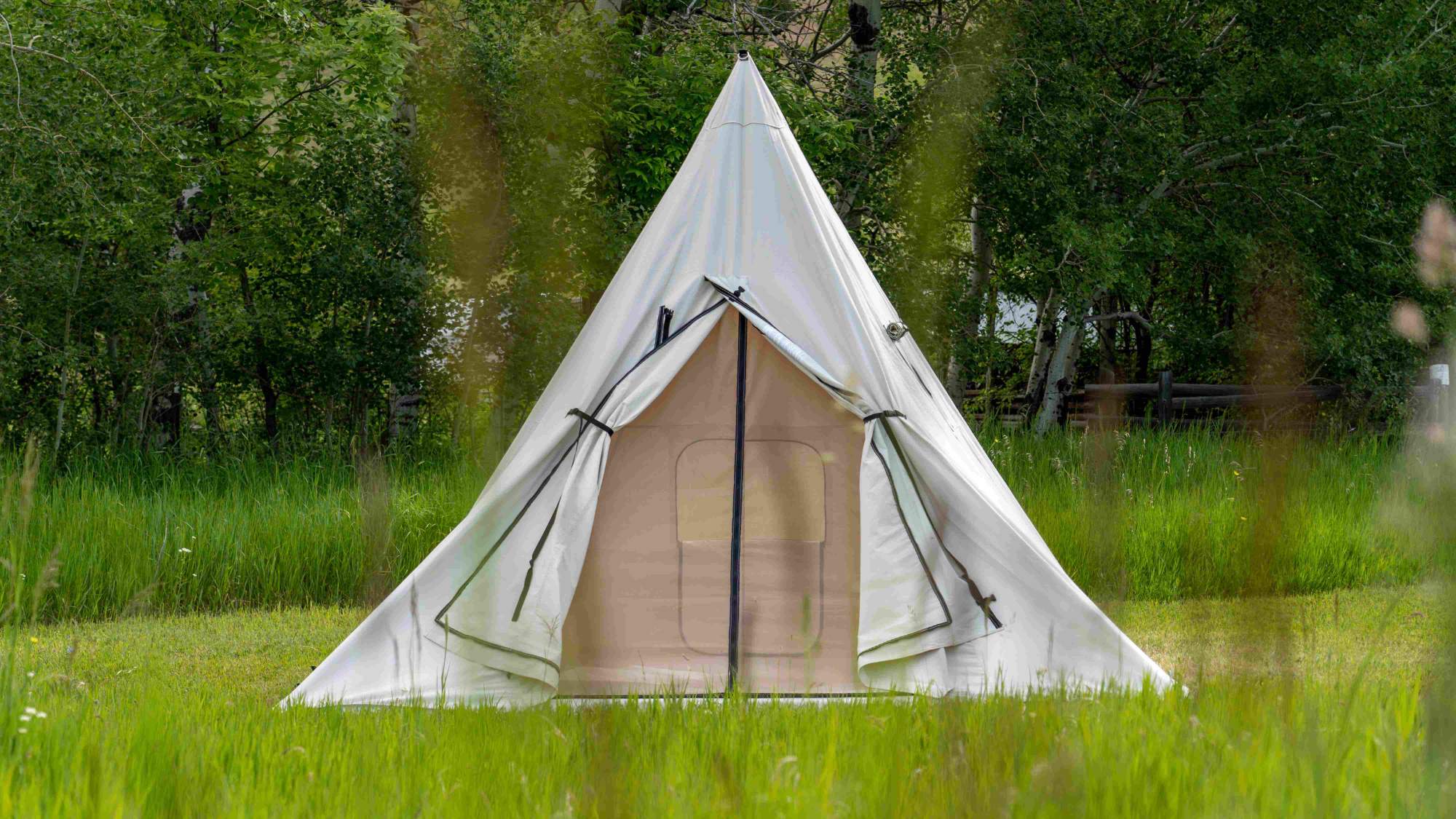 Canvas Range Tent with Screen Door in Grassy Meadow