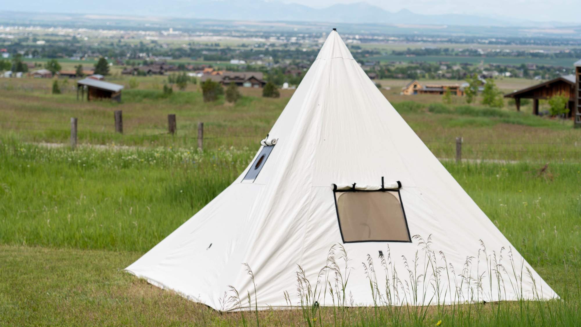 Canvas Range Tent in Grassy Field